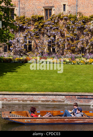 A punt on the River Cam in spring, passing Magdalene College, Cambridge UK Stock Photo