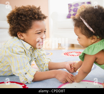 Black brother and sister playing together Stock Photo