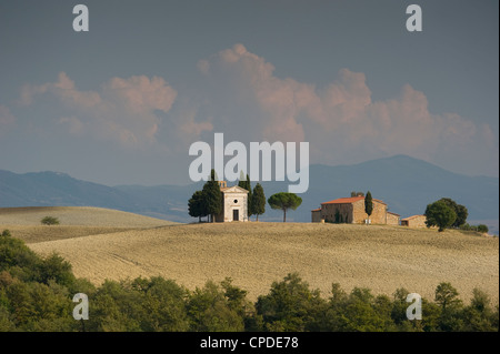 The Chapel Vitaleta and cypress trees on the rolling hills of Val d'Orcia, UNESCO World Heritage Site, Tuscany, Italy, Europe Stock Photo
