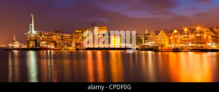 Arctic city of Tromso, harbour, port and waterfront warehouses, panorama at night, Tromso, Troms, North Norway, Scandinavia Stock Photo