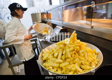 Chips being fried in traditional British chip shop, Gloucester, Gloucestershire, England, United Kingdom, Europe Stock Photo