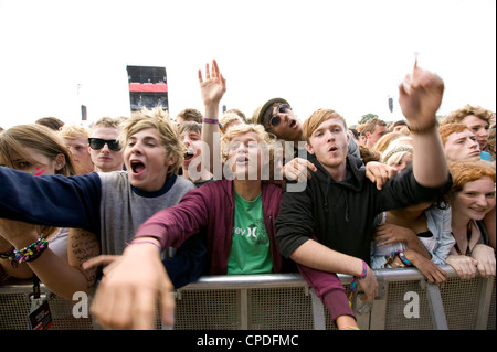 Crowd in front row screaming at a music concert Stock Photo