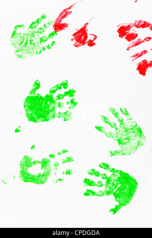 Children's hands prints in red and green watercolors Stock Photo