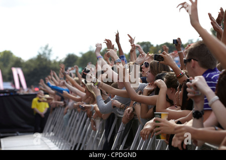 Front row crowd cheering hands in the air clapping Stock Photo - Alamy