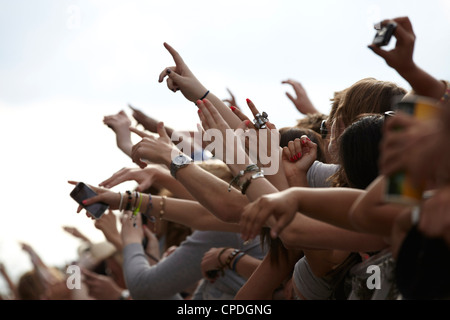 Front row crowd cheering hands in the air clapping Stock Photo - Alamy