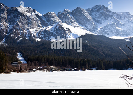 The Eibsee with the Zugspitze and the Eibsee Cable Car in the background Stock Photo