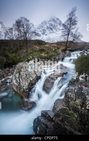 River Etive waterfalls with a snow capped Stob Dearg Buachaille Etive Mor, Glen Coe, Highlands, Scotland, UK Stock Photo