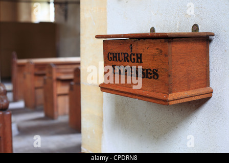 Wooden box marked 'CHURCH COLLECTIONS' at Shernborne church in Norfolk. Stock Photo