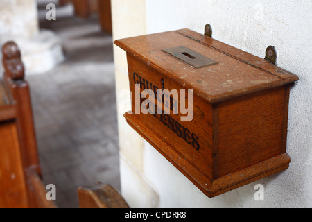 Wooden box marked 'CHURCH COLLECTIONS' at Shernborne church in Norfolk. Stock Photo