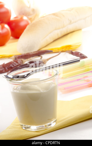 home made salad cream in a glass with a small spoon Stock Photo