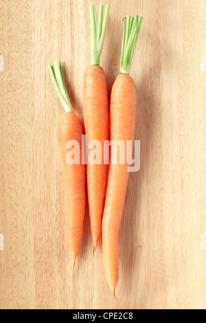 Carrots on cutting board Stock Photo