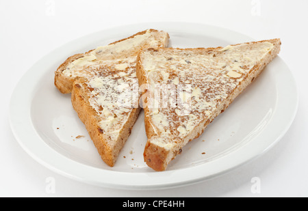 Buttered wholemeal toast cut into triangles Stock Photo