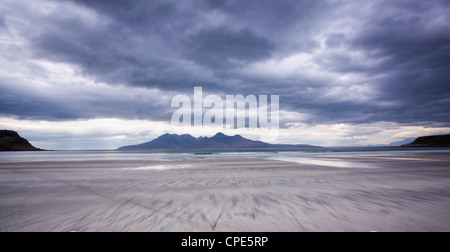 Early evening view towards Rum from the Bay of Laig on Eigg, Inner Hebrides, Scotland, United Kingdom, Europe Stock Photo