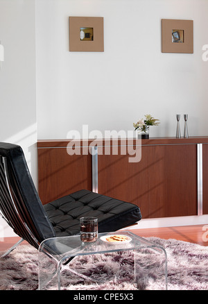 Modern Easy Chair With Side Table Stock Photo