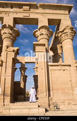 Man in white jellabiya in front of the Kiosk of Trajan at the Philae Temples, UNESCO World Heritage Site, Nubia, Egypt, Africa Stock Photo