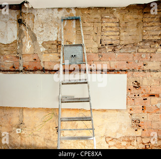 demolition debris in kitchen interior construction and ladder Stock Photo