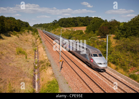 A TGV train speeds through the French countryside near to Tours, Indre-et-Loire, Centre, France, Europe Stock Photo