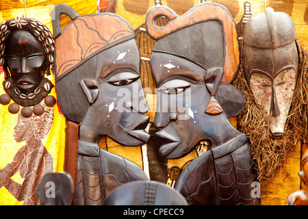 african handcraft dark wood carved profile faces Stock Photo