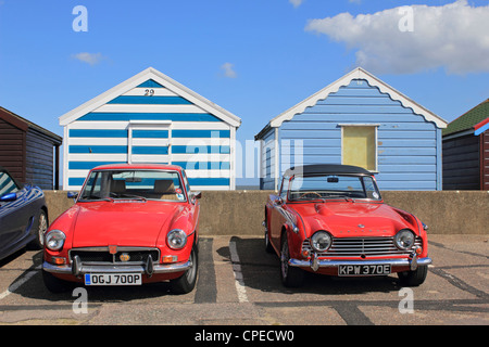Beach huts with MG and Triumph TR4 at the famous coastal resort of Southwold Suffolk England UK Stock Photo