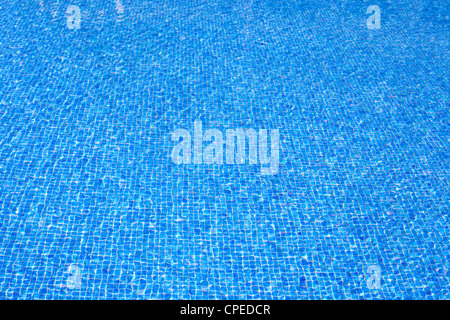 blue tiles pool water texture on clear summer sunny day Stock Photo