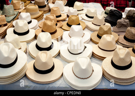 beige and white straw hats in a row male fashion accessories Stock Photo