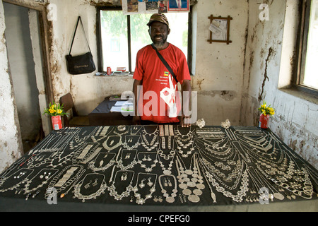 Silversmith with wares on Ibo island in the Quirimbas archipelago off the coast of northern Mozambique. Stock Photo