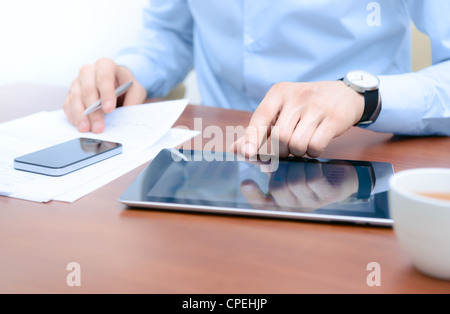 Businessman using new technologies for success workflow. Stock Photo