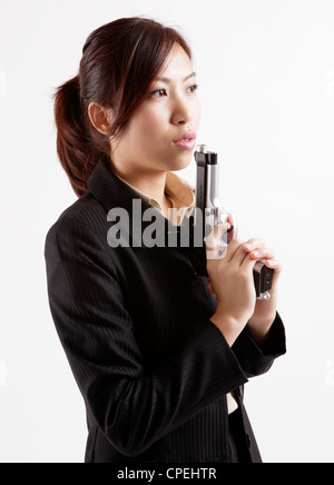 Portrait of office lady playing gun Stock Photo - Alamy