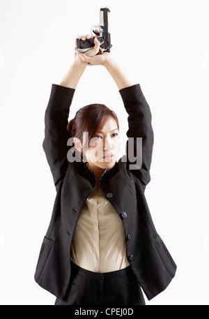 Portrait of office lady playing gun Stock Photo - Alamy