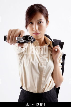 Portrait of office lady playing gun Stock Photo - Alamy