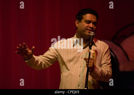 The stand-up comedian Paul Sinha performs at a comedy night in south London. Stock Photo