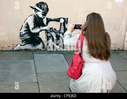 Security brought in to protect latest Banksy in Turnpike Lane, London - EDITORIAL USE ONLY/NO COMMERCIAL USE, ADVERTISING ETC Stock Photo