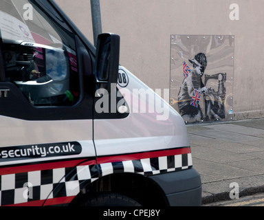 Security brought in to protect latest Banksy in Turnpike Lane, London - EDITORIAL USE ONLY/NO COMMERCIAL USE, ADVERTISING ETC Stock Photo