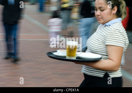 waitress with a beer Stock Photo