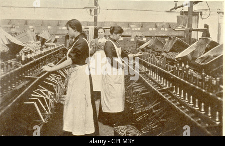 Bobbin winding in a Lancashire cotton mill Stock Photo