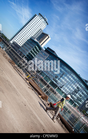 Workman near Media City Salford Gtr Manchester UK Stock Photo