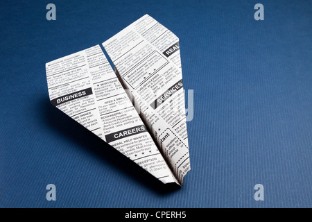 Newspaper Airplane, Classified Ad, business concept. Stock Photo