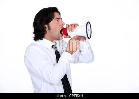 Man shouting in speaker Stock Photo