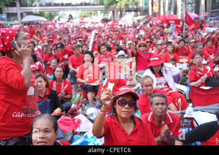 Red-Shirt supporters listen to speeches commemorating the second anniversary of a military-led crackdown in Bangkok. Stock Photo