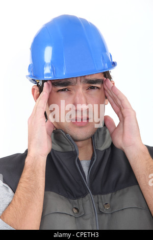 Builder with headache Stock Photo