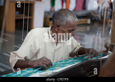 Indian man weaving Stock Photo