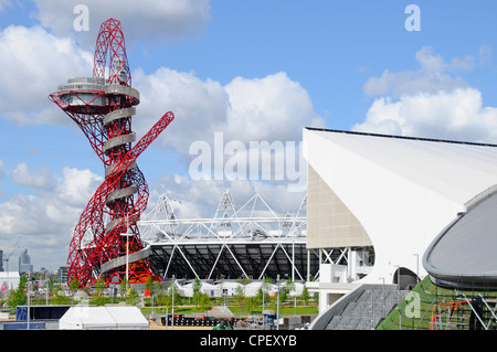 ArcelorMittal Orbit tower part of main stadium & corner of Aquatics Centre temporary stand 2012 London Olympic park Stratford East London England UK Stock Photo