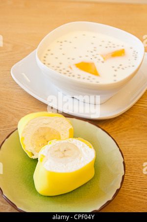 Breakfast: Milk and cake on table Stock Photo