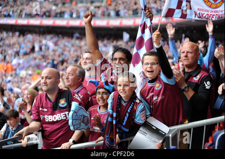 Jubilant West Ham United football fans celebrating victory at Wembley Stock Photo