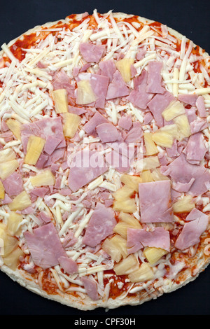 Uncooked Ham and Pineapple Pizza Stock Photo