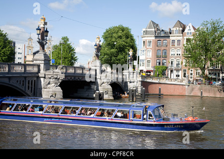 Netherlands. Amsterdam. Tourist boat on river Amstel. Stock Photo