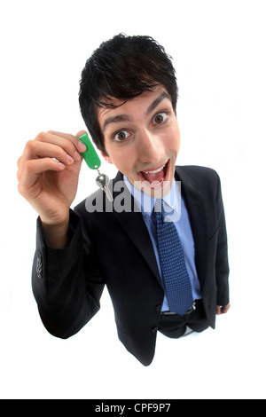 A crazy businessman handing a key. Stock Photo