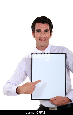 Man holding up a blank bulletin board Stock Photo