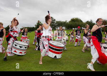 Batala drumming band from Lancaster -performing  on the Glede -at Bowness on Lake Windermere English LaKe District Cumbria UK Stock Photo