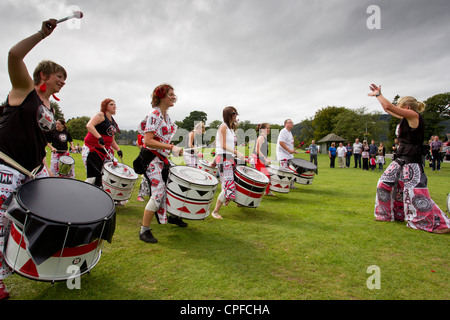 Batala drumming band from Lancaster -performing  on the Glede -at Bowness on Lake Windermere English LaKe District Cumbria UK Stock Photo